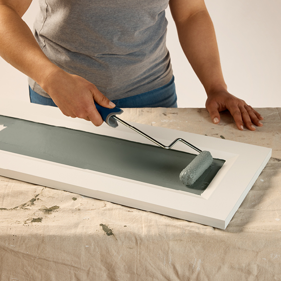 Six-image carousel of living room, child’s room, entryway, backyard and kitchen, all incorporating Renew Blue.