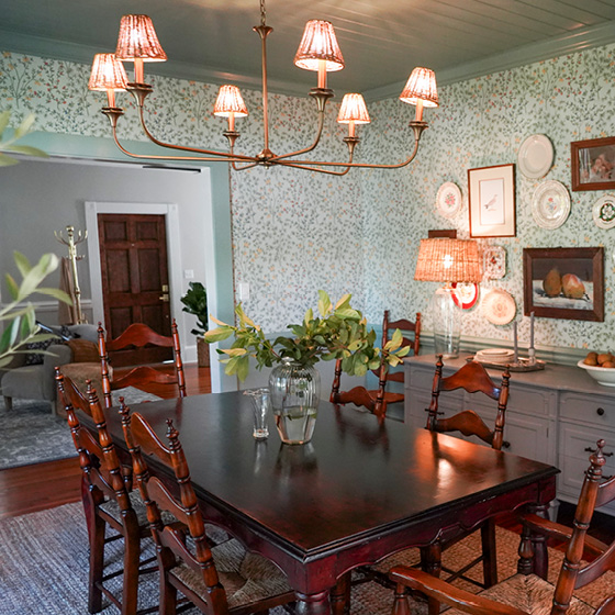 Six-image carousel of living room, child’s room, entryway, backyard and kitchen, all incorporating Renew Blue.